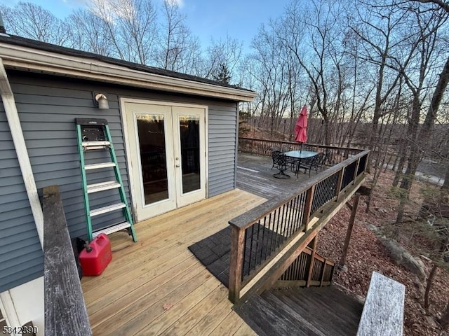 deck featuring french doors and outdoor dining area