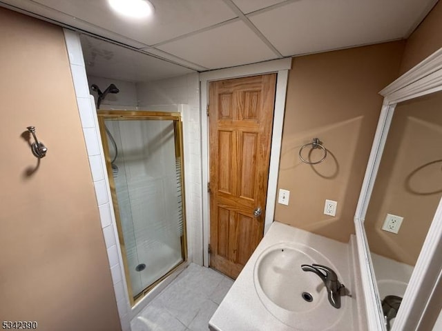 bathroom with a shower stall and vanity