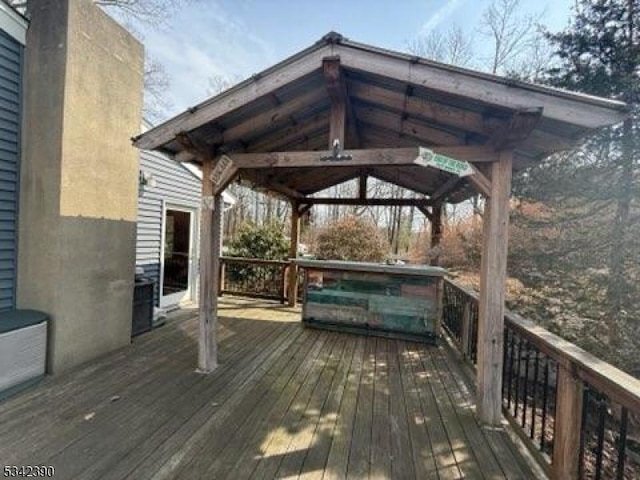 wooden terrace with a gazebo