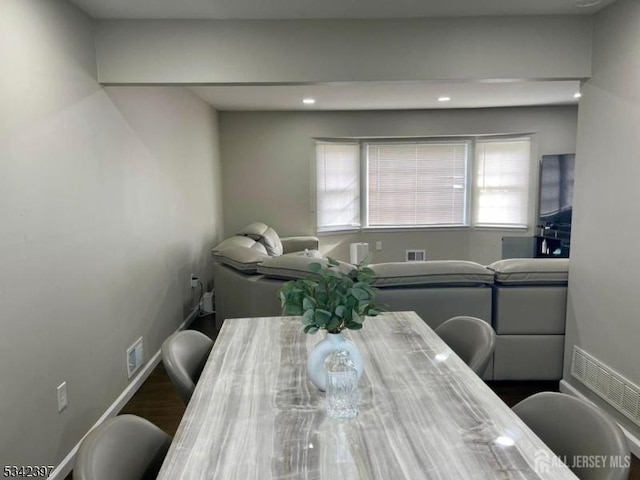 dining space featuring baseboards and visible vents