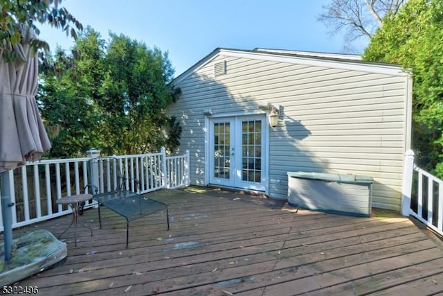 wooden deck featuring french doors