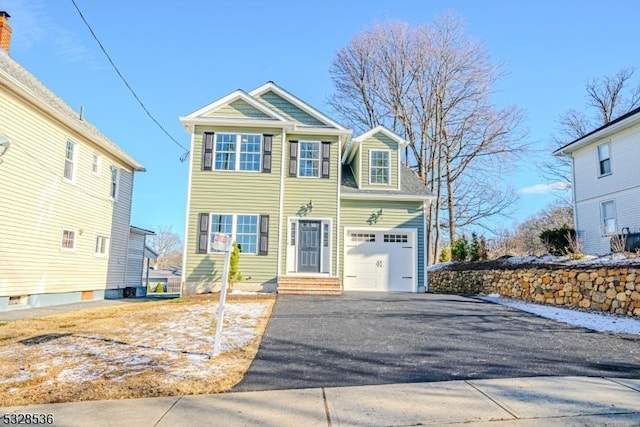 view of front of house featuring aphalt driveway