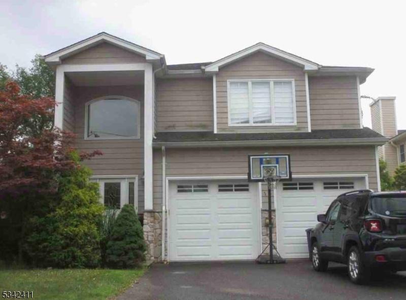 view of front of property with a garage and driveway