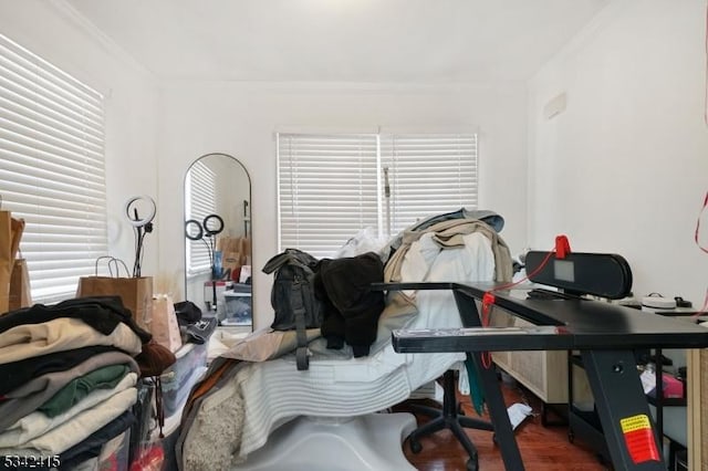 office area with wood finished floors and ornamental molding