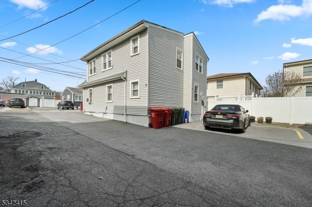 view of side of property with fence