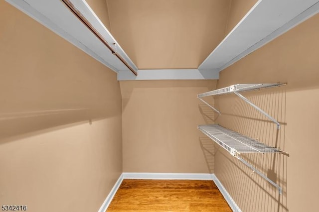 spacious closet with wood finished floors