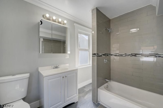 full bath featuring crown molding, shower / bathing tub combination, toilet, vanity, and baseboards