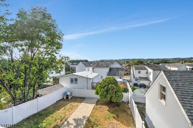 exterior space featuring fence private yard and a residential view