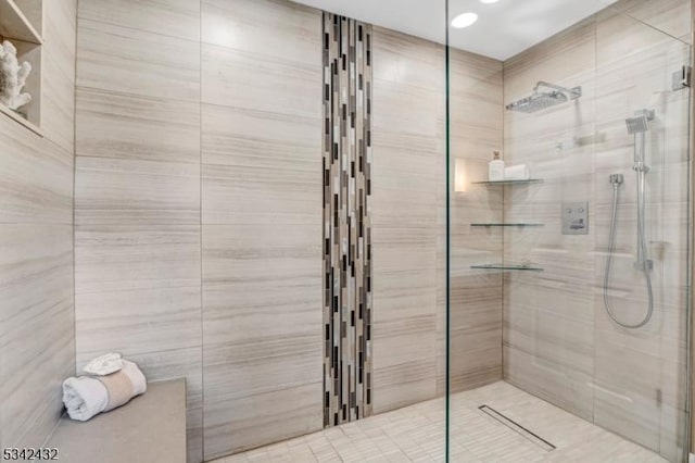 full bathroom with a tile shower