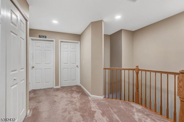 hall featuring recessed lighting, carpet flooring, and baseboards