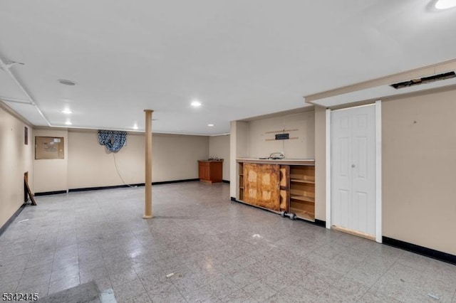 finished basement featuring baseboards and recessed lighting