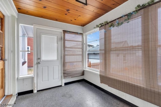 unfurnished sunroom with wooden ceiling