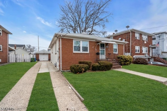 view of front facade featuring an outbuilding, brick siding, a front yard, and fence