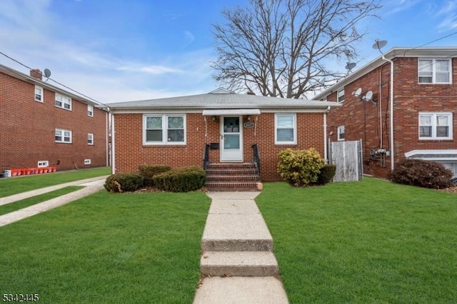 bungalow-style house featuring a front lawn and brick siding