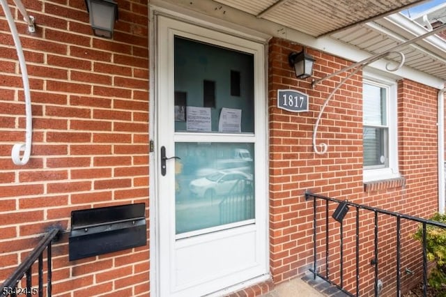 entrance to property with brick siding