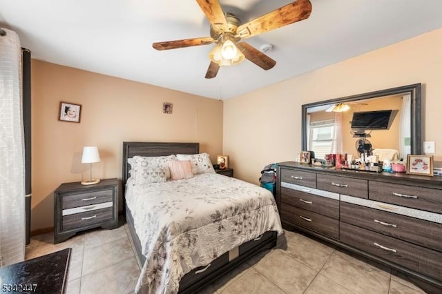 bedroom featuring light tile patterned floors and ceiling fan