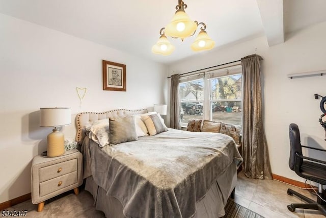 tiled bedroom featuring beamed ceiling and baseboards