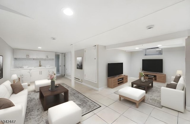 living area featuring recessed lighting, baseboards, and light tile patterned floors