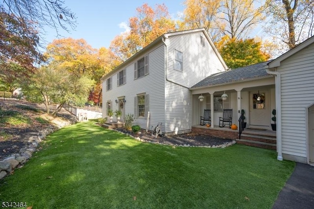 exterior space featuring a porch and a yard