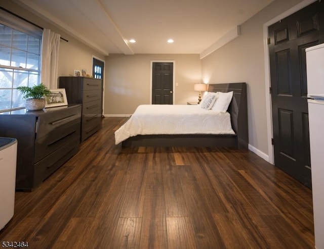 bedroom with dark wood-style floors, recessed lighting, and baseboards