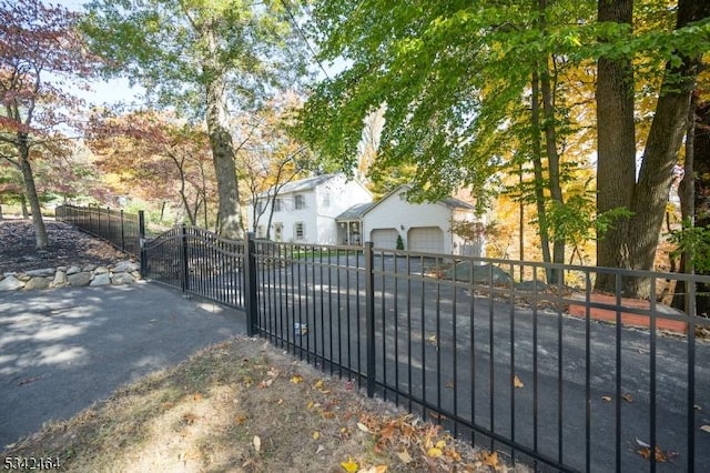 view of gate featuring fence