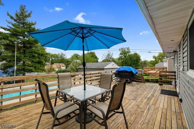 deck featuring outdoor dining area