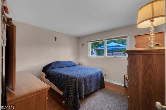 bedroom with wood finished floors