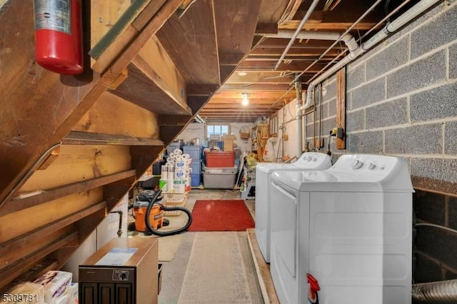 below grade area with washing machine and clothes dryer