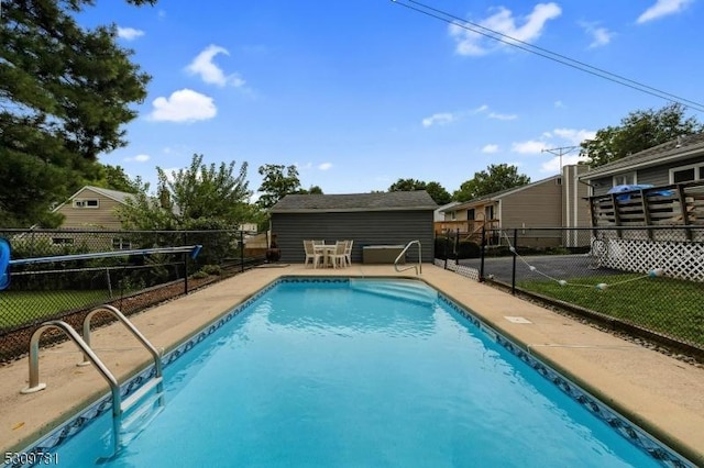 view of pool with a fenced in pool, a patio area, an outdoor structure, and fence