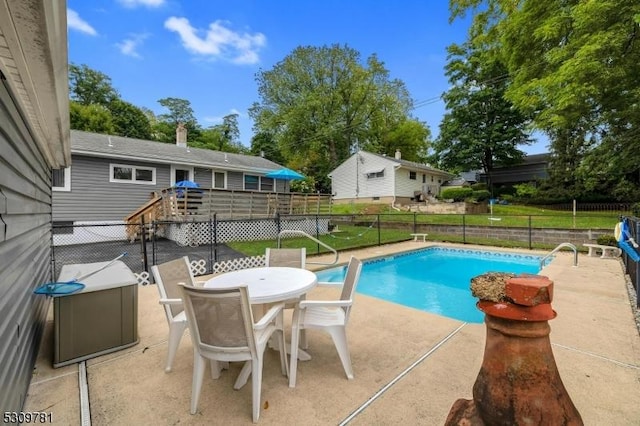 view of swimming pool with a fenced in pool, a patio, outdoor dining area, and a fenced backyard