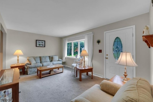 living room featuring baseboards and carpet floors