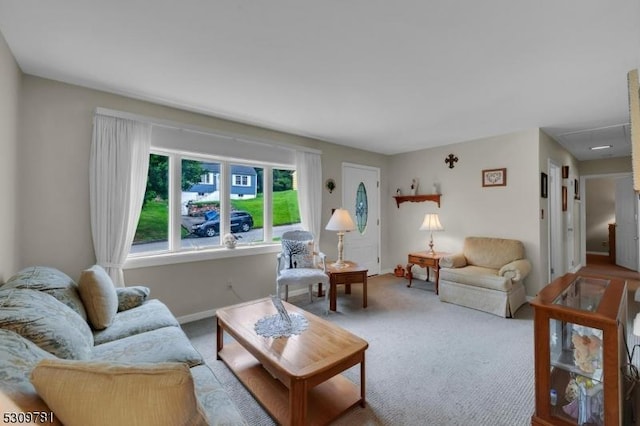 living room with baseboards and carpet flooring