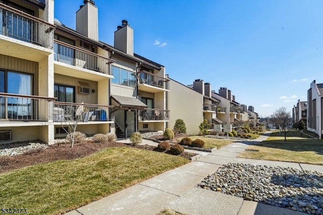 surrounding community featuring a residential view and a yard