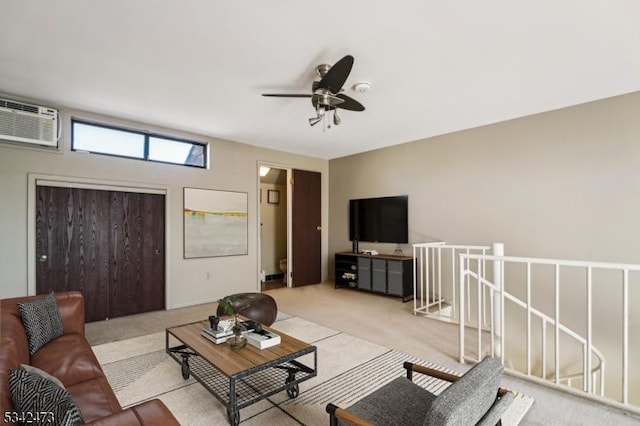 living room with carpet floors, a ceiling fan, and an AC wall unit