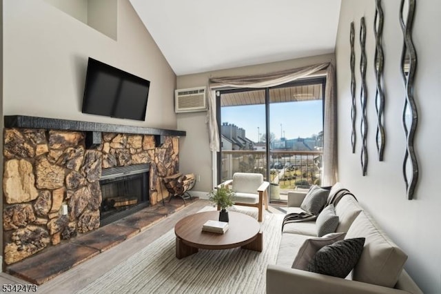 living room with lofted ceiling, a wall mounted air conditioner, and a fireplace