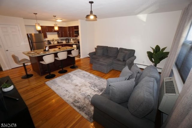 living area with wood finished floors