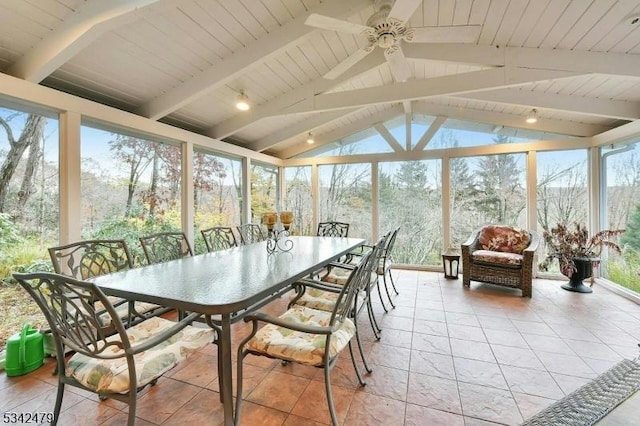 sunroom / solarium with vaulted ceiling with beams, wood ceiling, and a ceiling fan