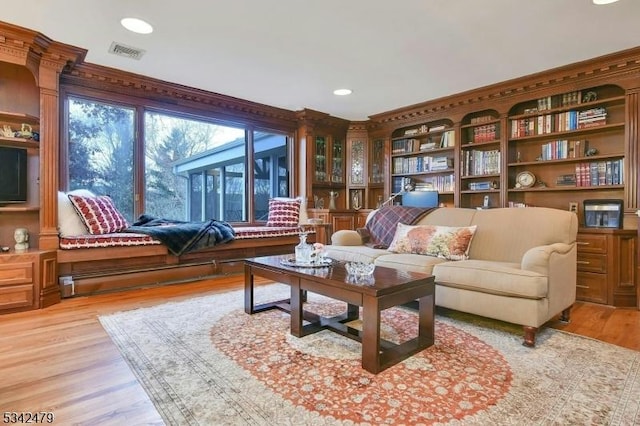 sitting room featuring light wood-type flooring, visible vents, and recessed lighting