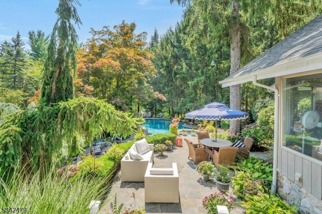 view of patio / terrace featuring an outdoor hangout area and an outdoor pool