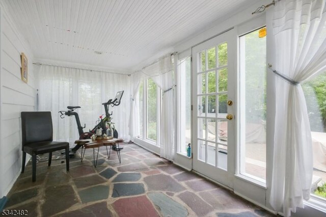 sunroom featuring plenty of natural light