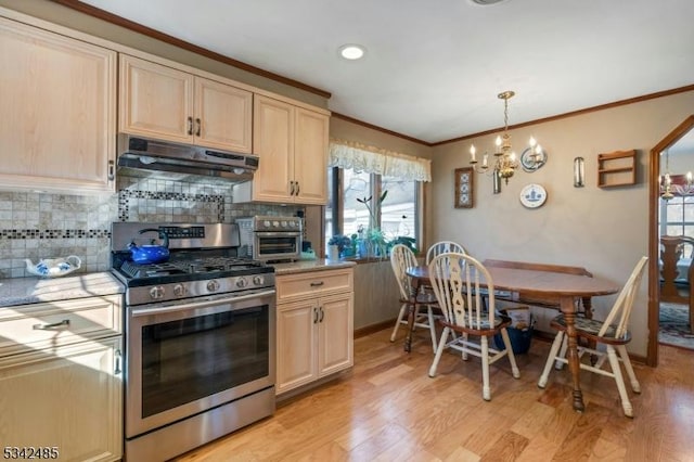 kitchen with light brown cabinetry, stainless steel gas range, light wood-style flooring, and under cabinet range hood