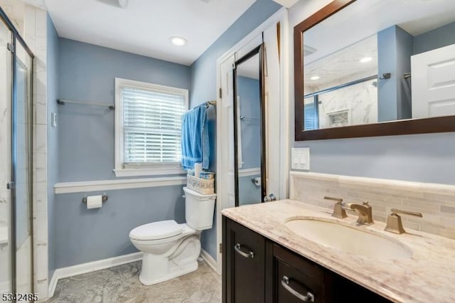 bathroom with backsplash, baseboards, a shower stall, and toilet