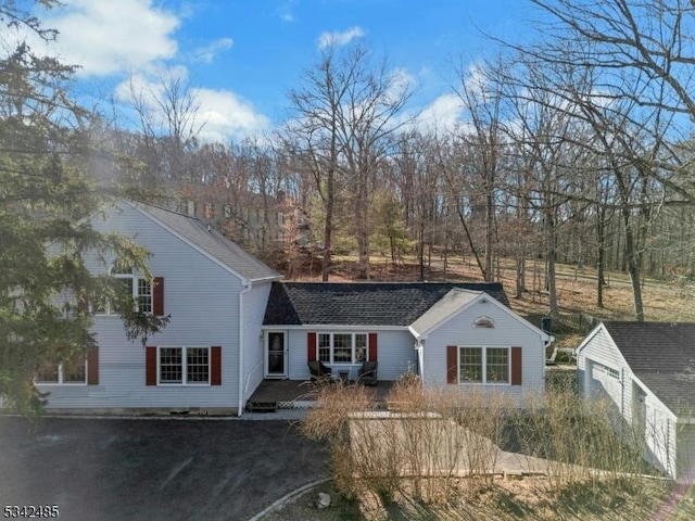 view of front of house with roof with shingles