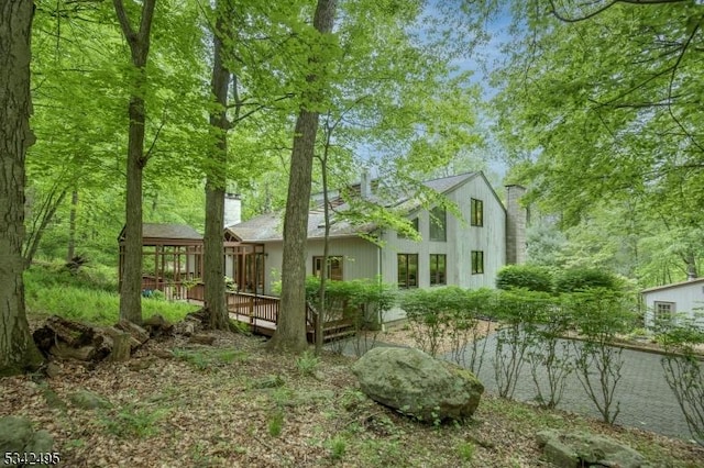 5 Apgar Way, Tewksbury Twp, NJ 08833 - rear view of property with a chimney and a wooden deck