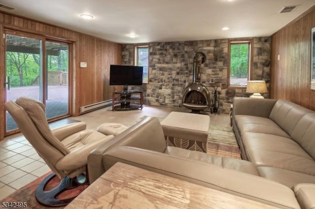 5 Apgar Way, Tewksbury Twp, NJ 08833 - living room featuring wood walls, a wood stove, and tile patterned floors