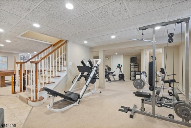 exercise area featuring a paneled ceiling and recessed lighting