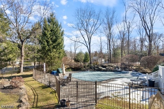 view of pool featuring a patio, fence, and a fenced in pool