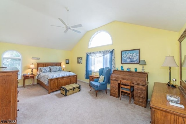 carpeted bedroom with lofted ceiling and ceiling fan