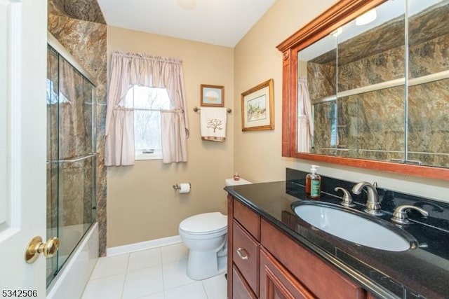 full bath featuring baseboards, toilet, enclosed tub / shower combo, tile patterned floors, and vanity