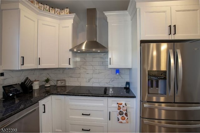 kitchen with white cabinetry, wall chimney exhaust hood, appliances with stainless steel finishes, and backsplash